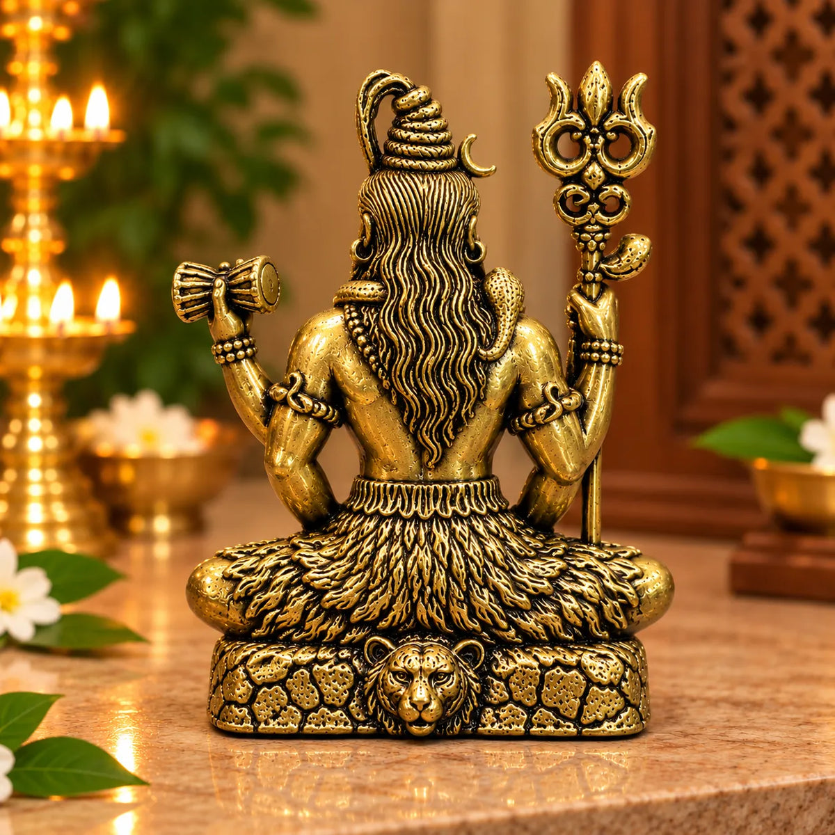 Antique Golden Brass Lord Shiva Idol with Trishul & Damru on Lion-Motif Rock Base