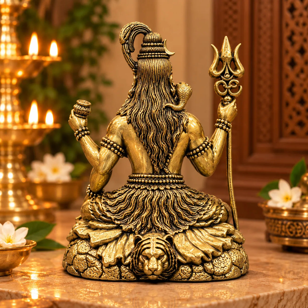 Antique Golden Brass Lord Shiva Idol with Trishul & Damru on Lion-Motif Rock Base